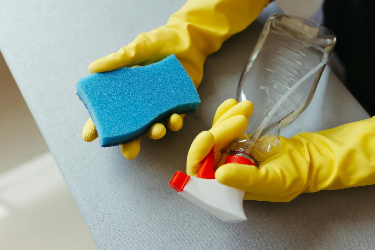 blue sponge with yellow gloves